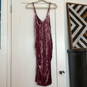 Pink strappy velvet dress.